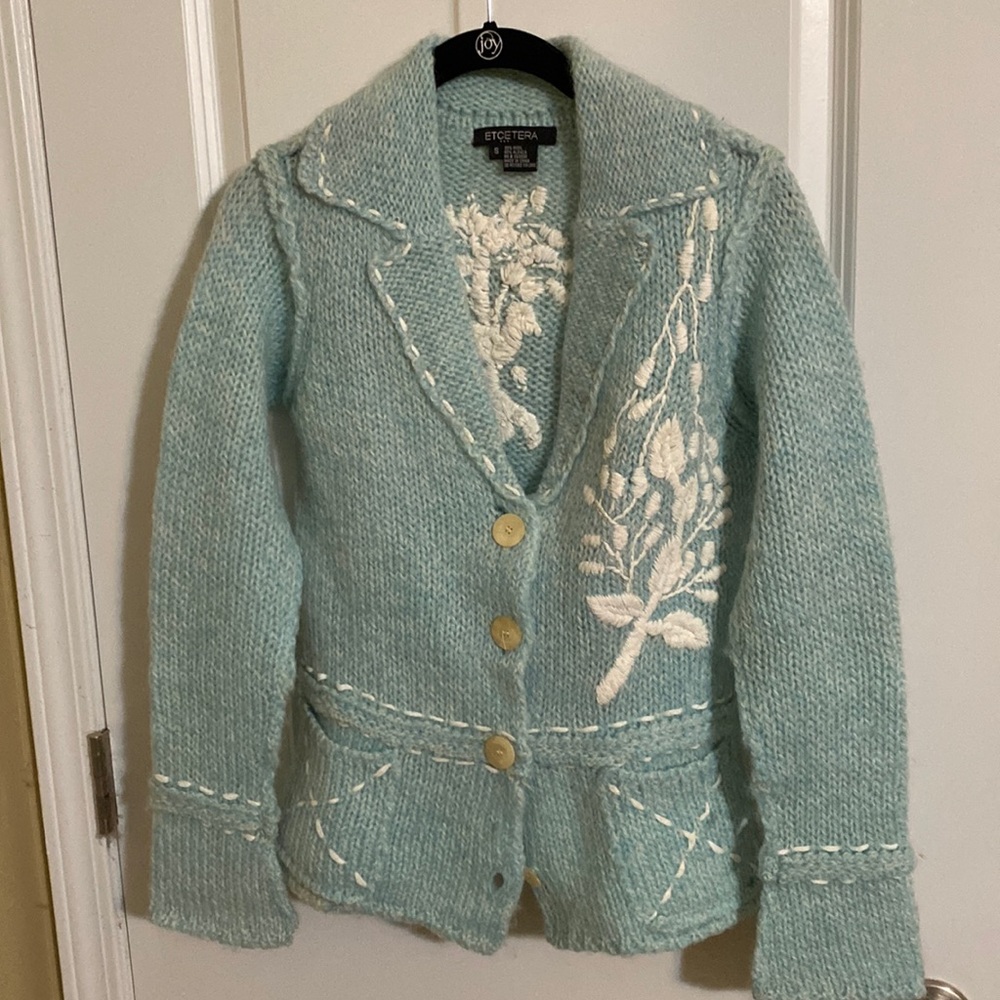 Blue and white wool/alpaca blend sweater.